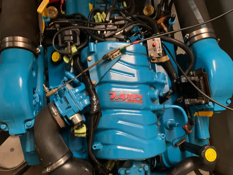 Slide: The Image of Engine of a 2000 Silverton 392 Motor Yacht, featuring a blue 7.4 MPI motor. - 20