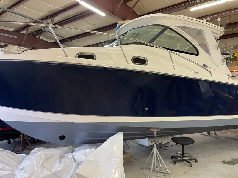 Slide: The Image of 2012 Pursuit 315 Offshore boat in indoor storage facility. - 3