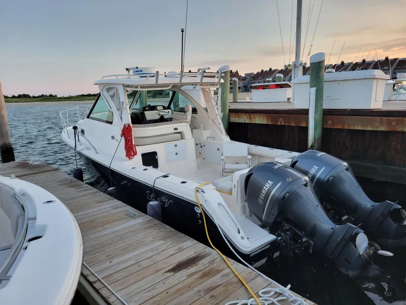 Slide: The Image of 2012 Pursuit 315 Offshore boat docked with twin Yamaha engines. - 6