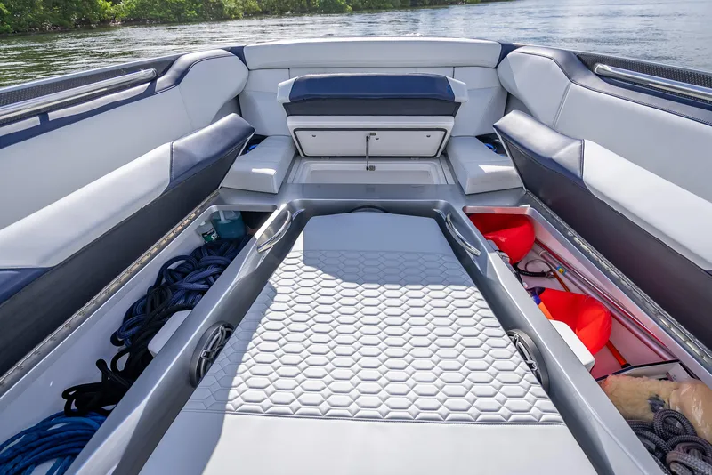 Slide: The Image of 2024 Nor-Tech 450 Sport Center Console interior with spacious seating and storage compartments. - 10