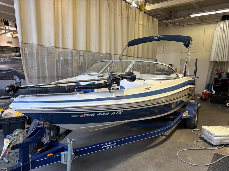Slide: The Image of 2006 Tahoe Q4 Sport boat on trailer in indoor storage facility. - 3