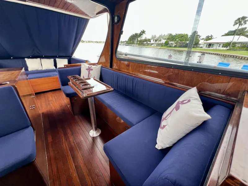 Slide: The Image of Luxurious 2013 Custom O'Neill Craft Tritoon interior with blue seating and nautical decor. - 13