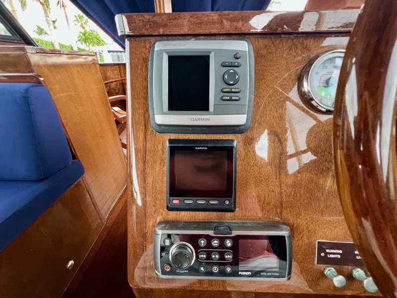 Slide: The Image of Wooden dashboard of 2013 O'Neill Craft Tritoon with Garmin and Fusion electronics. - 20
