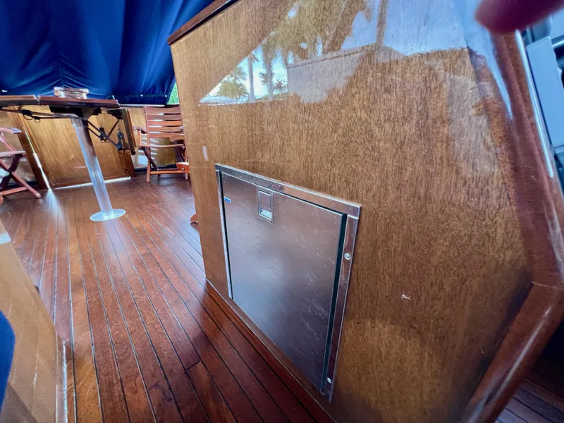 Slide: The Image of Wooden interior of 2013 Custom O'Neill Craft Tritoon with polished flooring and seating. - 23