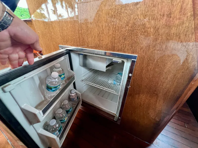 Slide: The Image of Mini fridge on 2013 O'Neill Craft Tritoon with bottled water inside. - 24