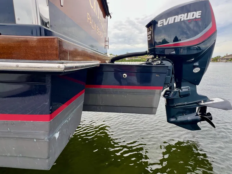 Slide: The Image of 2013 Custom O'Neill Craft Tritoon with Evinrude motor on water. - 26