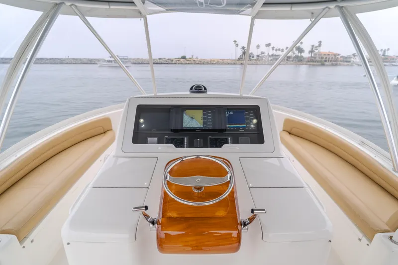 Slide: The Image of Viking 48 Convertible 2017 yacht helm with navigation screens and leather seating. - 10