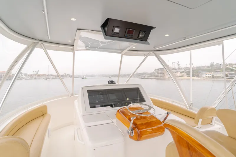 Slide: The Image of Interior helm of 2017 Viking 48 Convertible yacht with panoramic view. - 11
