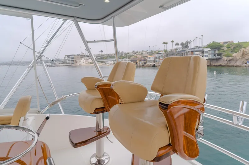 Slide: The Image of Luxurious seating on 2017 Viking 48 Convertible yacht, overlooking serene waterfront. - 12