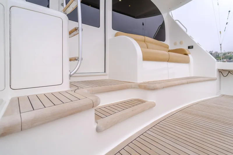 Slide: The Image of 2017 Viking 48 Convertible yacht deck with teak steps and seating. - 16