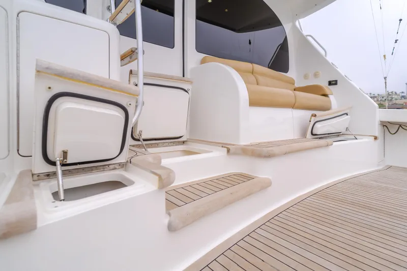 Slide: The Image of 2017 Viking 48 Convertible yacht deck with seating and storage compartments. - 17