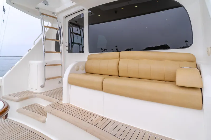 Slide: The Image of 2017 Viking 48 Convertible yacht with beige seating and teak flooring. - 18