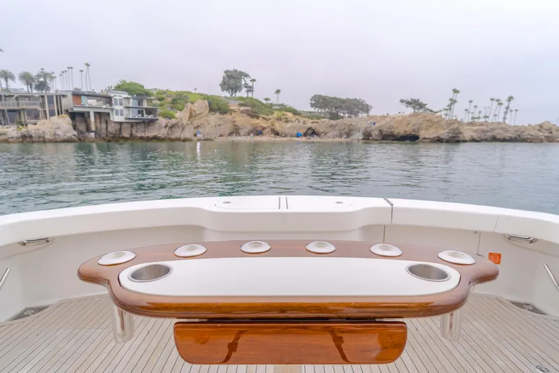 Slide: The Image of Viking 48 Convertible 2017 yacht deck with scenic coastal view. - 19