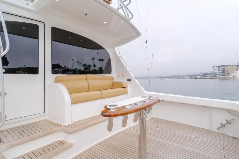 Slide: The Image of 2017 Viking 48 Convertible yacht deck with seating and ocean view. - 20