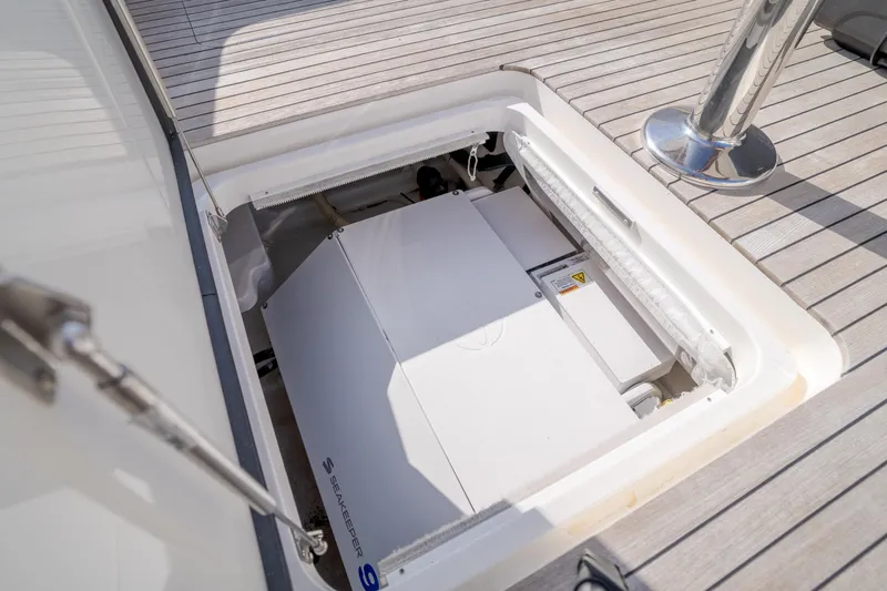 Slide: The Image of Engine compartment of 2017 Viking 48 Convertible yacht, showcasing clean design and functionality. - 21