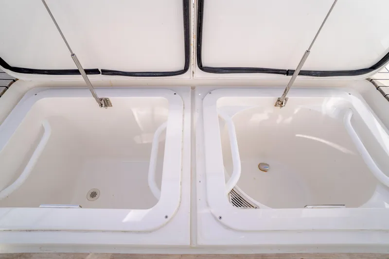 Slide: The Image of Open storage compartments on a 2017 Viking 48 Convertible boat. - 23