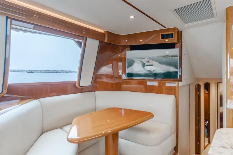 Slide: The Image of Luxurious interior of 2017 Viking 48 Convertible yacht with plush seating and TV. - 26