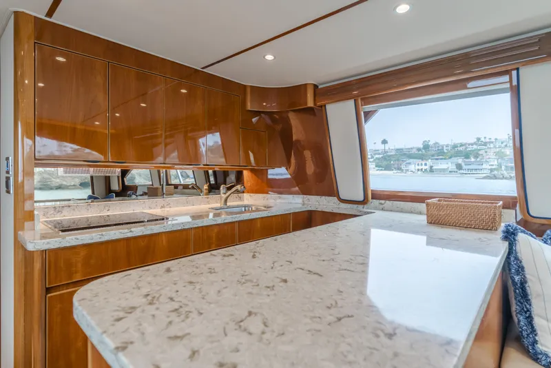 Slide: The Image of Luxurious kitchen interior of 2017 Viking 48 Convertible yacht with sleek countertops. - 27