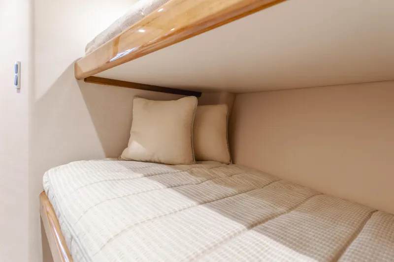 Slide: The Image of Cozy bunk beds in 2017 Viking 48 Convertible yacht cabin. - 34