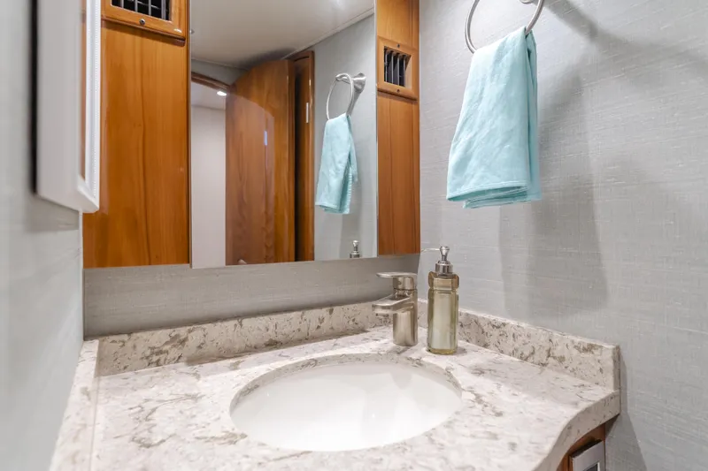 Slide: The Image of Luxurious bathroom in 2017 Viking 48 Convertible yacht with marble countertop and modern fixtures. - 37