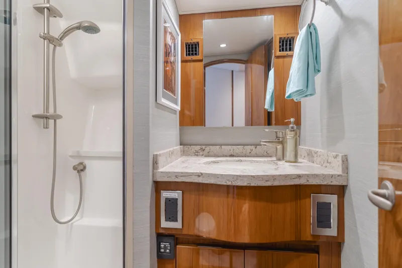 Slide: The Image of Luxurious bathroom in 2017 Viking 48 Convertible yacht with modern fixtures and elegant design. - 38