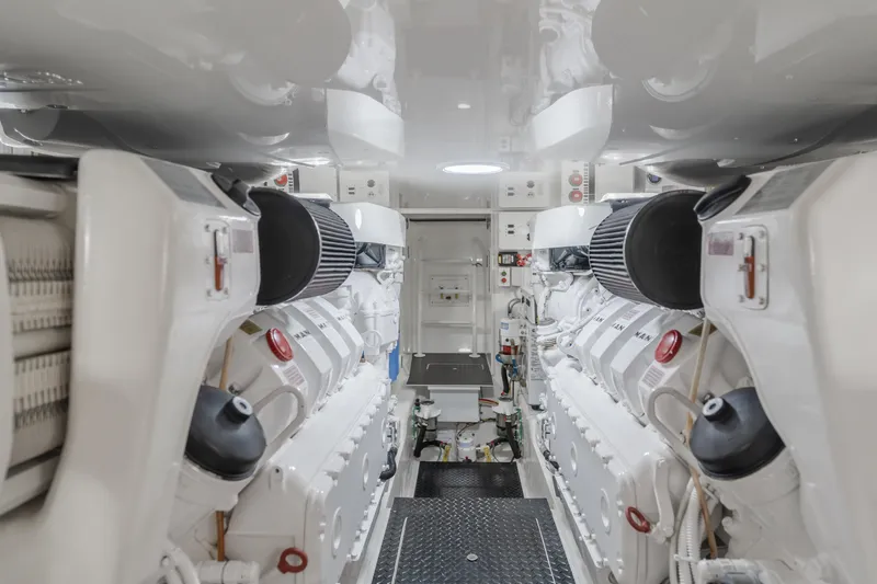 Slide: The Image of Engine room of 2017 Viking 48 Convertible yacht, showcasing dual engines and clean design. - 40