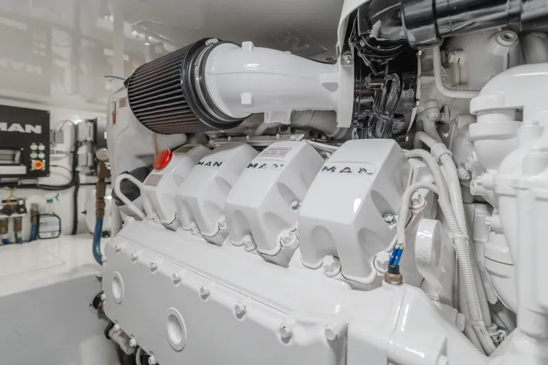 Slide: The Image of Engine room of 2017 Viking 48 Convertible yacht, featuring a MAN engine. - 41
