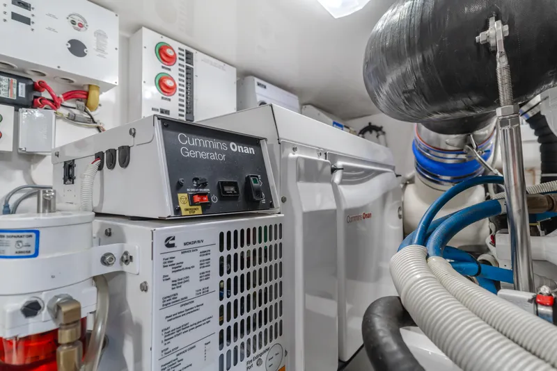 Slide: The Image of Engine room of 2017 Viking 48 Convertible with Cummins Onan generator. - 42