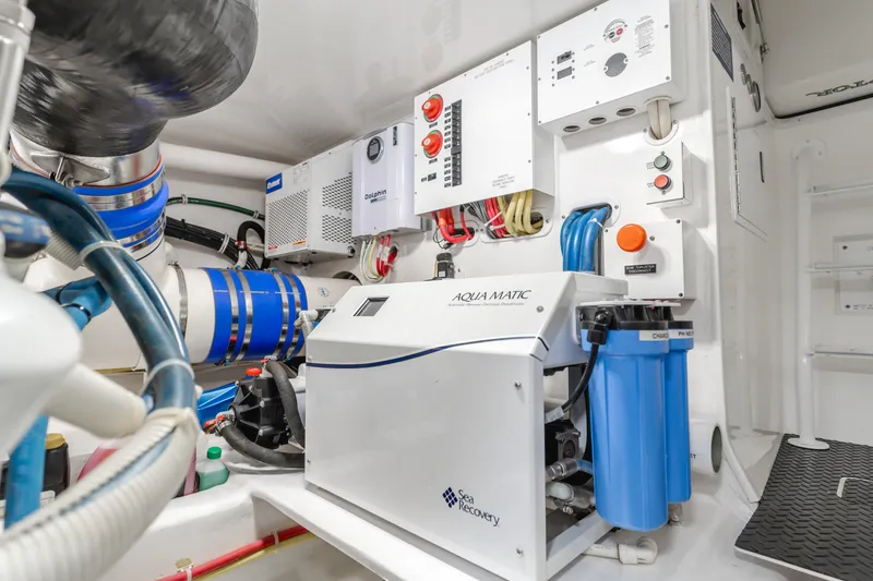 Slide: The Image of Engine room of 2017 Viking 48 Convertible yacht with Aqua Matic watermaker system. - 43