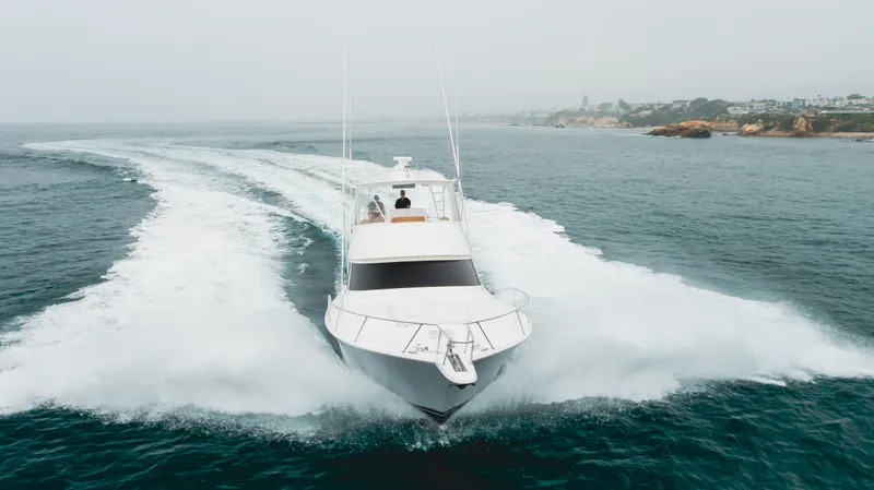 Slide: The Image of 2017 Viking 48 Convertible yacht cruising on open water. - 5