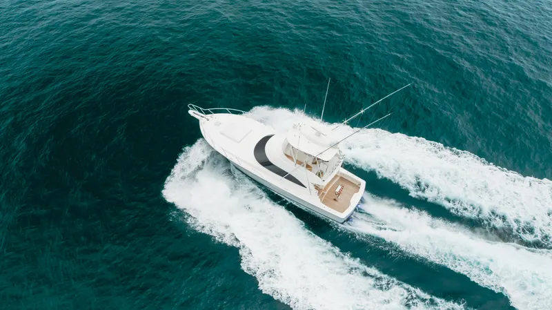 Slide: The Image of Aerial view of 2017 Viking 48 Convertible yacht cruising on open water. - 6