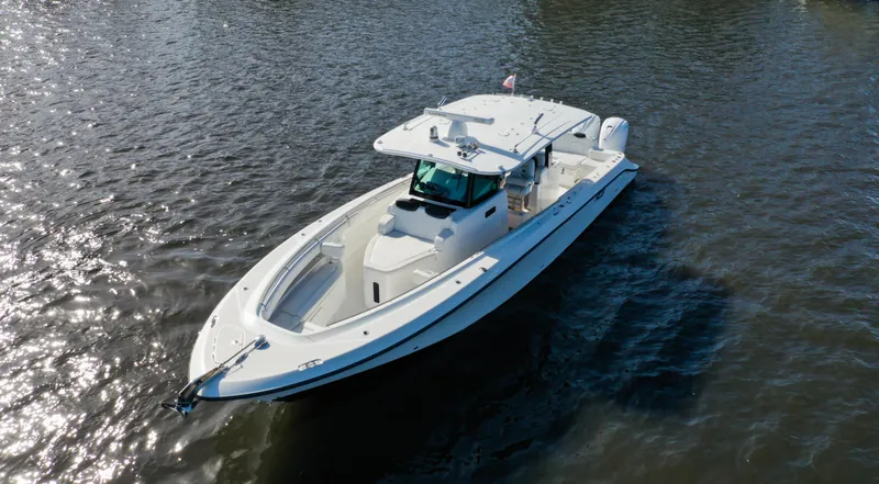 Slide: The Image of 2022 HCB 42 Lujo boat cruising on calm waters. - 10