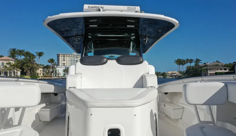 Slide: The Image of 2022 HCB 42 Lujo boat with sleek design, spacious seating, and modern navigation system. - 27