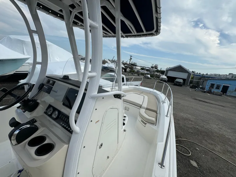 Slide: The Image of 2019 Boston Whaler 240 Dauntless boat interior with steering console and seating. - 8
