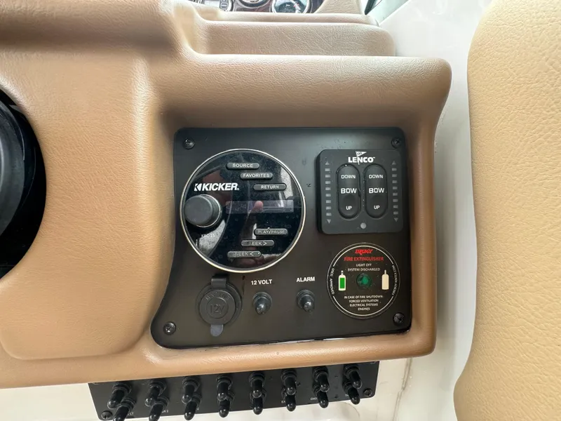 Slide: The Image of Control panel of 2020 Crownline 286 SC boat with Kicker audio system. - 9