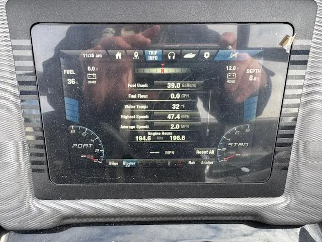 Slide: The Image of Dashboard of a 2019 Yamaha Boats AR240 showing trip info and engine metrics. - 14