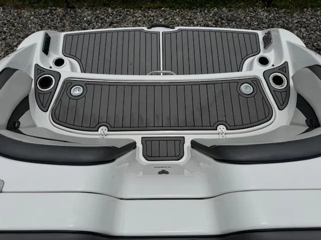 Slide: The Image of 2019 Yamaha Boats AR240 swim platform with gray decking and cup holders. - 23