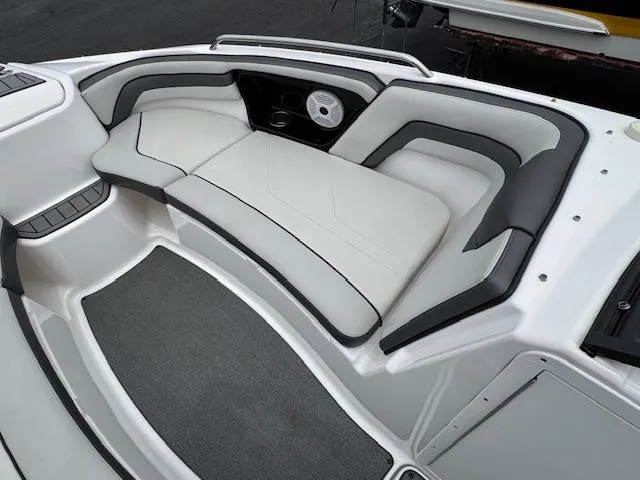 Slide: The Image of 2019 Yamaha AR240 boat interior with cushioned seating and speaker system. - 6