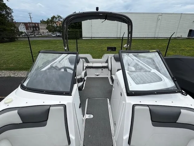 Slide: The Image of 2019 Yamaha AR240 boat interior with dual consoles and open bow design. - 9