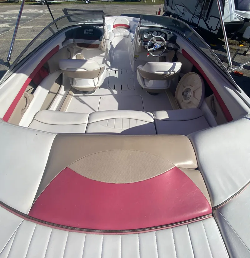 Slide: The Image of 2006 Four Winns 210 Horizon boat interior with red and beige seating. - 11