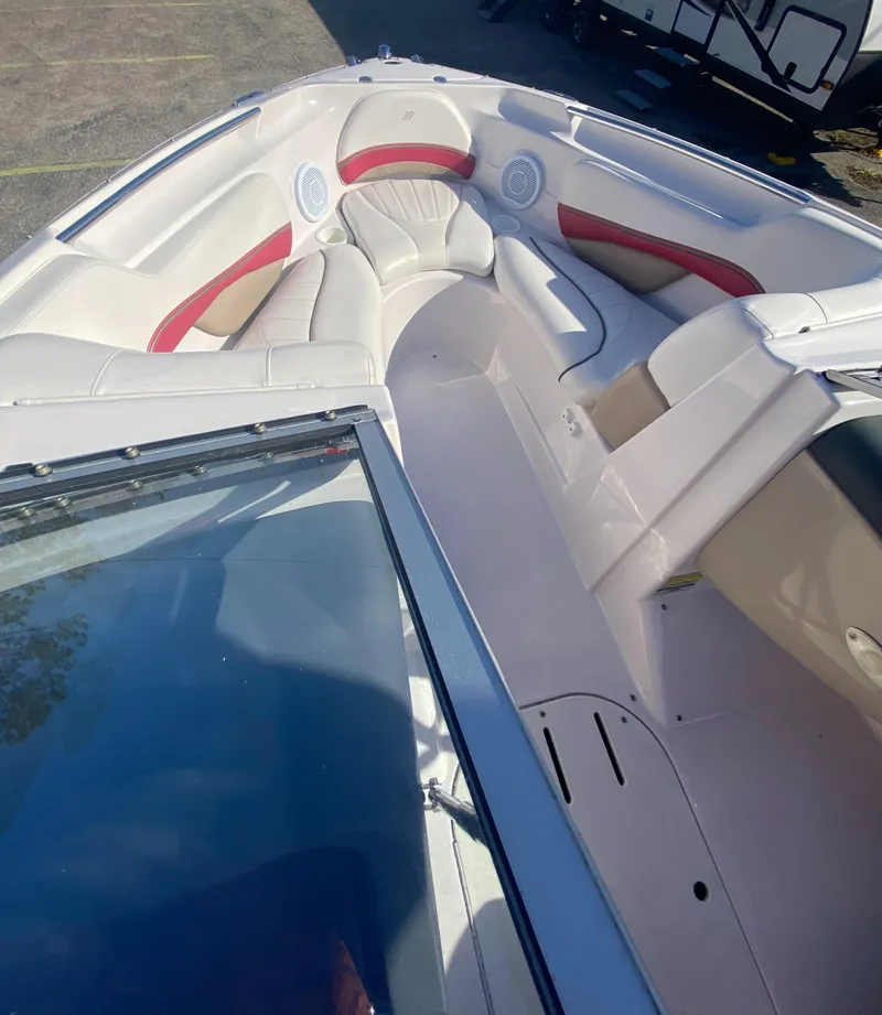 Slide: The Image of 2006 Four Winns 210 Horizon boat interior with red and white seating. - 12