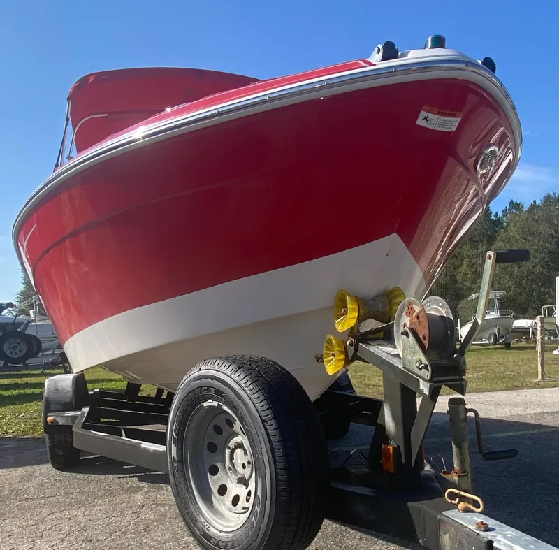Slide: The Image of Red 2006 Four Winns 210 Horizon boat on trailer, sunny day. - 8