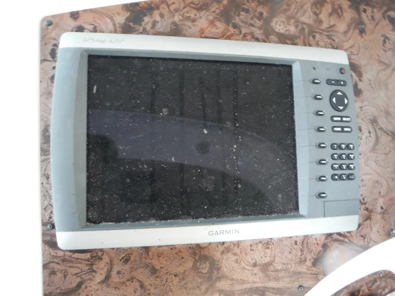 Slide: The Image of Garmin GPS device on 2002 Doral 310se boat dashboard. - 12