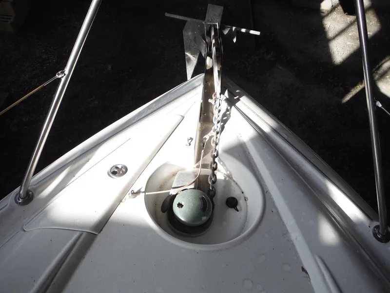 Slide: The Image of Bow of 2002 Doral 310se boat with anchor chain and deck fittings. - 17