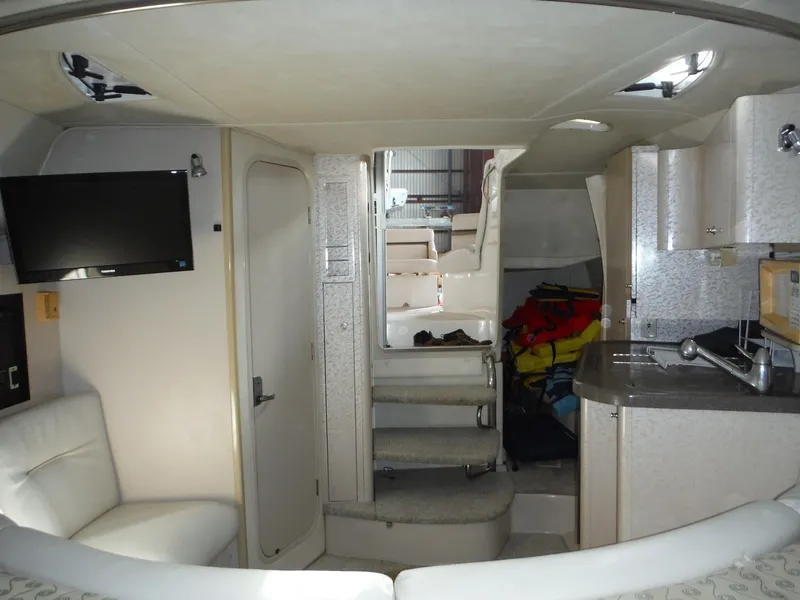 Slide: The Image of Interior of 2002 Doral 310se boat with modern amenities and seating. - 24