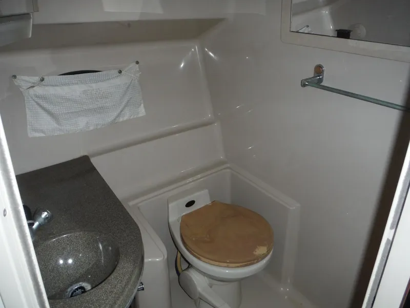Slide: The Image of 2002 Doral 310se boat bathroom with sink and toilet. - 25