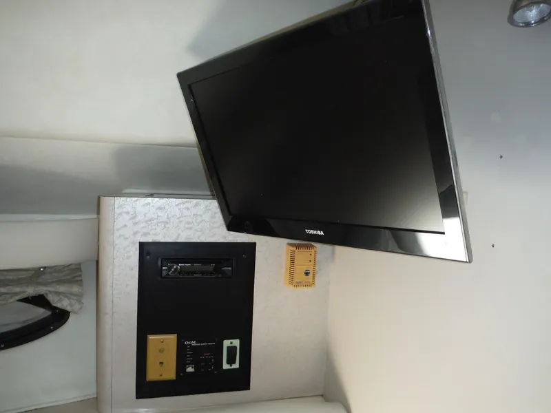 Slide: The Image of 2002 Doral 310se interior with mounted Toshiba TV and control panel. - 26