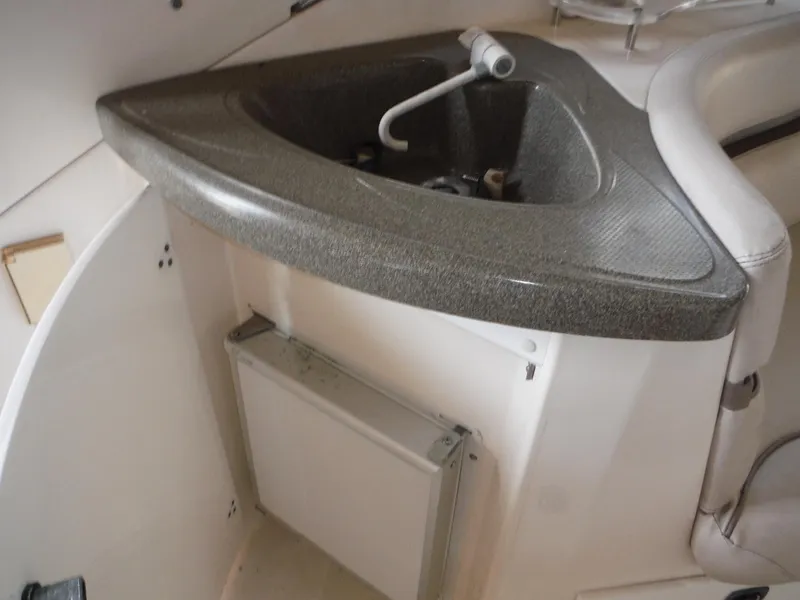 Slide: The Image of 2002 Doral 310se boat interior with compact sink and countertop. - 37