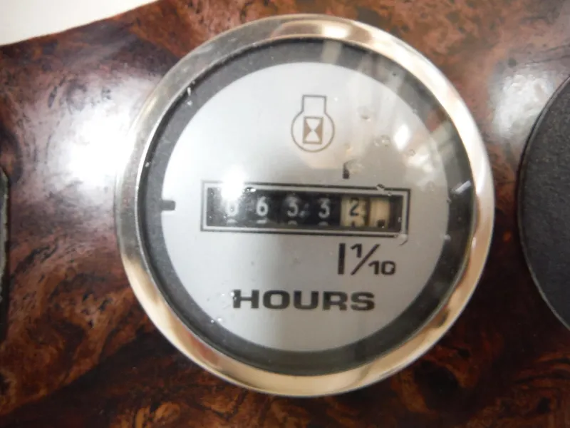 Slide: The Image of Hour meter reading 653.2 hours on 2002 Doral 310se dashboard. - 39