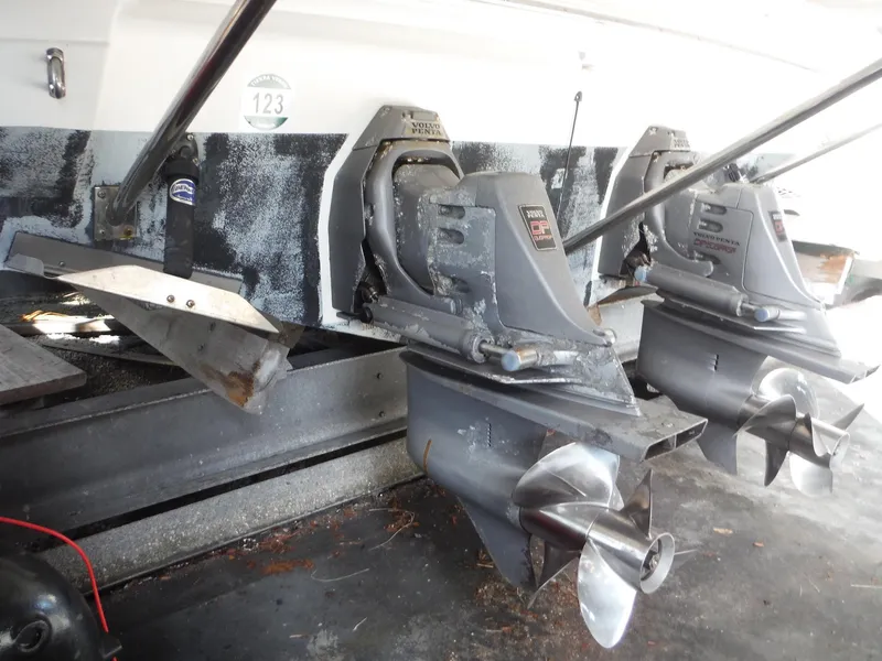 Slide: The Image of 2002 Doral 310se boat with dual outboard motors in a garage. - 45